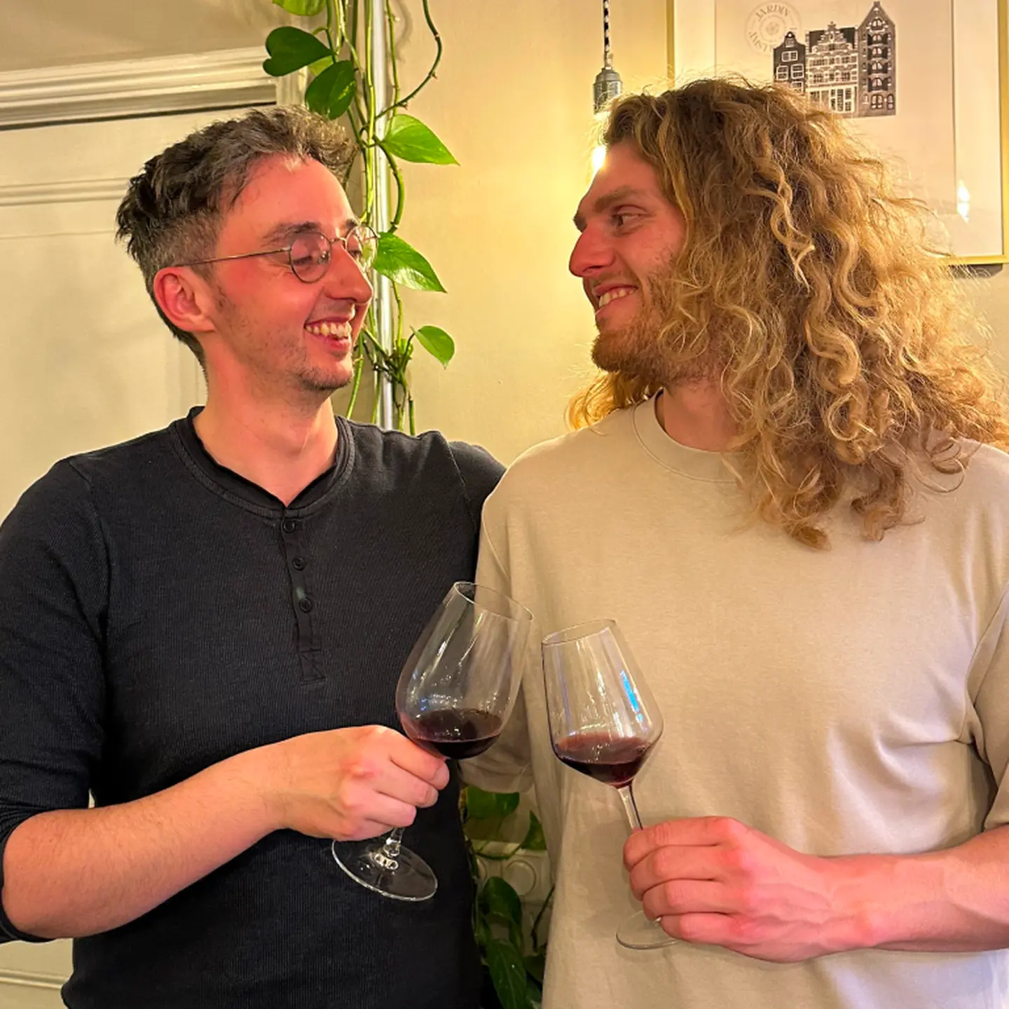 two men drinking wine
